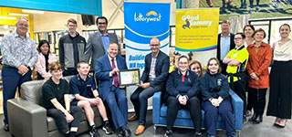 Good Sammy employees in a group photo with Minister Don Punch celebrating the Lotterywest certificate