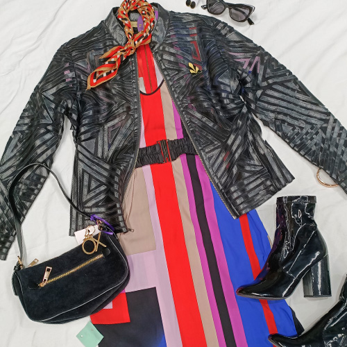 a geometric-print silk shift dress by Country Road paired with a vintage bomber jacket and black patent ankle boots.