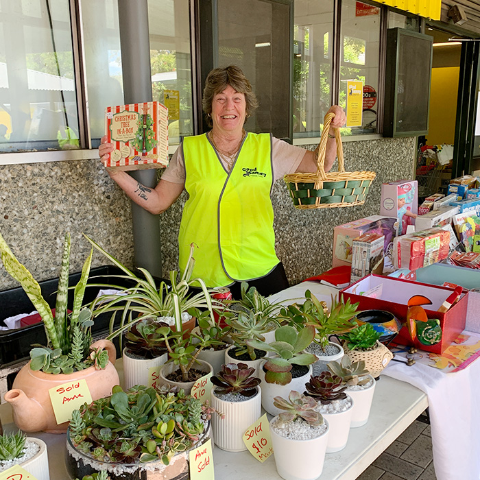 Volunteer, Dawn, selling handmade pot plants and and pre-loved goodies