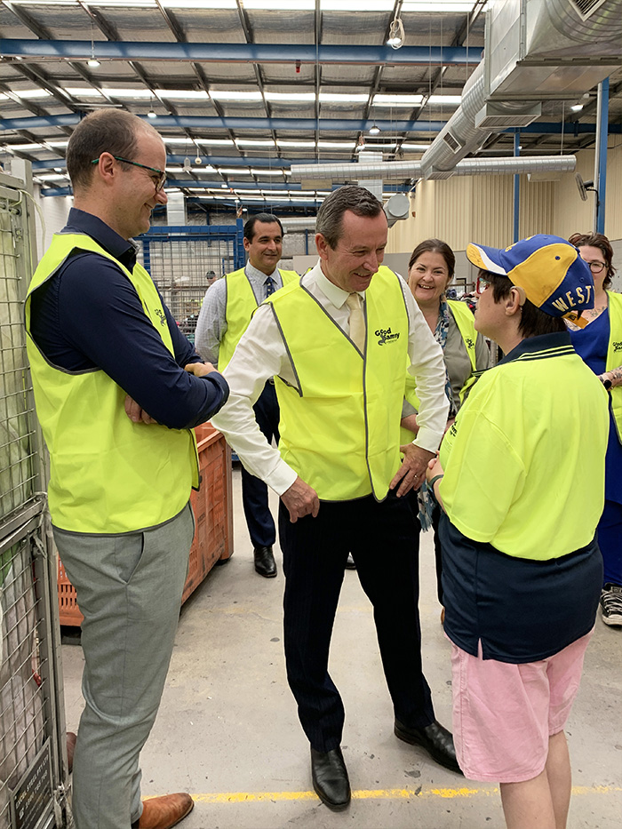 Good Sammy employee with disability, Deb, talking with the premier and member for Jandakot and the good sammy team smiles in the background.