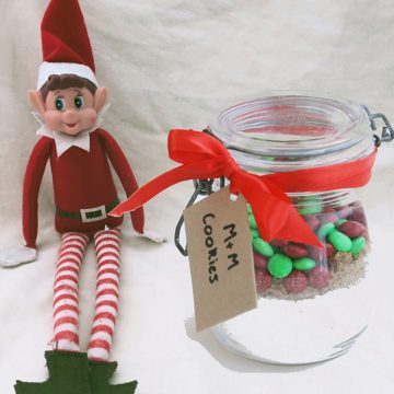 Mason jar with dry cookie mix inside.