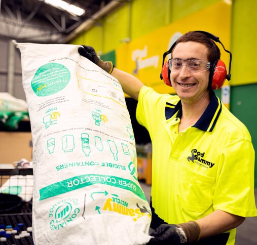 Young man working in the recycling centre