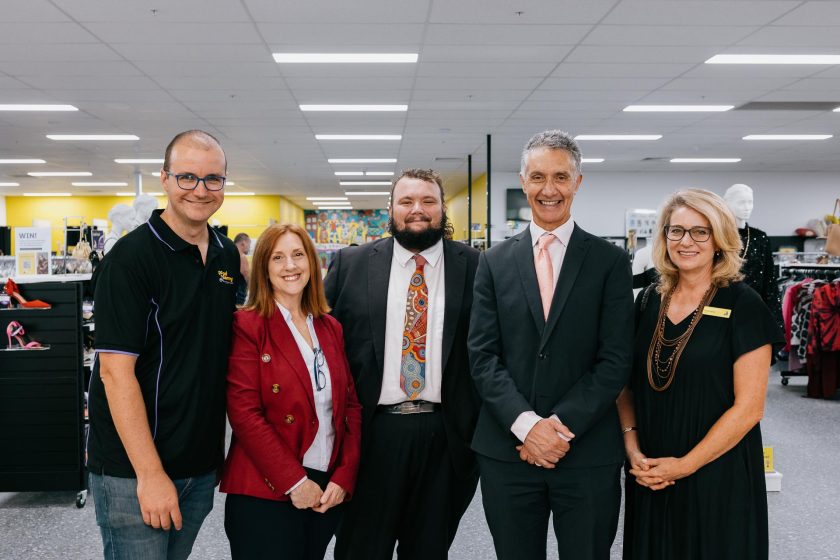 Local, state and federal members of government smiling at camera during a event.