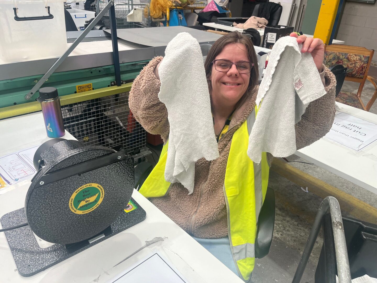 Good Sammy employee cutting low grade towels into rags